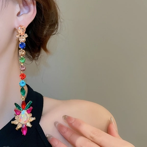 Close-up of colorful rhinestone water drop earrings with vibrant crystal pendants