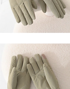 Detail showing khaki thermal gloves with touchscreen fingertips for outdoor riding