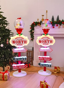 Luminous Christmas road sign decor with North Pole crystal ball and glowing street lamps