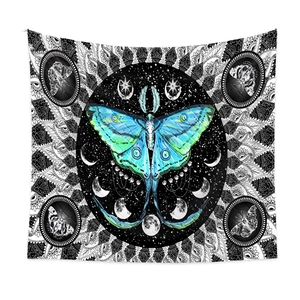 Close-up of Luna moth tapestry featuring detailed teal wings and celestial phases