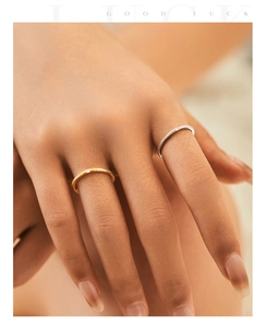 Detail of s925 silver ring with irregular foil texture and a sparkling center stone