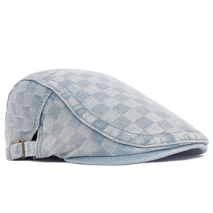Detail of checkered denim beret showing side profile and vintage metal adjustment buckle