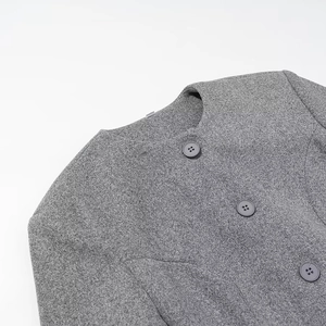 Women's minimalist grey wool coat featuring a round neck design and three dark buttons