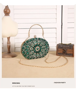 Detailed close-up of green sunflower evening clutch with crystals and gold ring handle