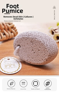 Close-up of a natural grey volcanic pumice stone with a hanging rope on a wooden surface