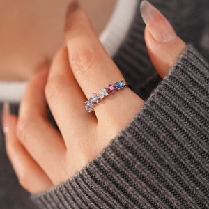 Detail of 18k gold plated open ring with colorful zircon flower clusters on model hand