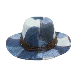 Detail of vintage patchwork denim fedora with embossed leather band and silver rivets