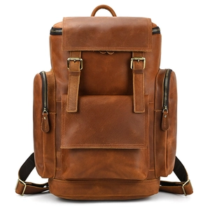 Close-up of crazy horse leather texture and detailed stitching on brown backpack