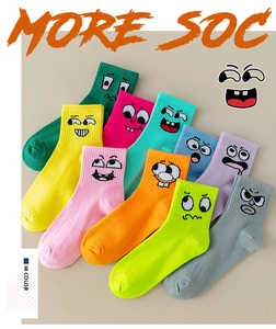 Colorful mid-calf crew socks with funny cartoon faces in multiple bright vibrant colors