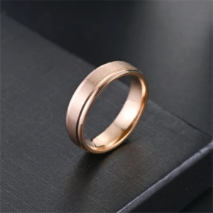 Close-up of rose gold titanium steel ring with matte finish and polished edges
