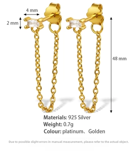 Detail of 925 sterling silver golden chain earrings with rectangular zircon and 48mm length