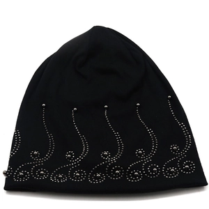 Detail of black cotton beanie showing intricate silver beadwork in a spiral pattern