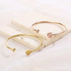 Adjustable C-shaped stainless steel bracelets in gold and rose gold with zircon stones