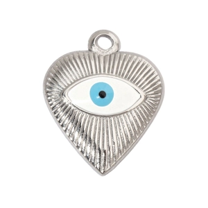 Macro shot of silver heart pendant with textured finish and blue evil eye detail