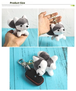 Macro view of mini husky plush toy used as a decorative keychain on a car key bag