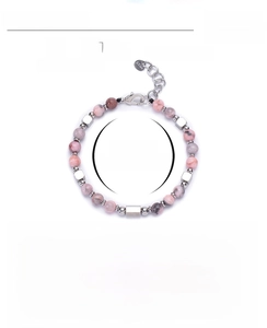 Detailed close-up of 6mm pink zebra stone beads and stainless steel silver accents