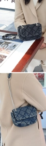 Detailed close-up of denim quilted chain bag with silver strap and lifestyle view