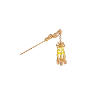 Golden vintage hair pin with luminous lantern pendant and pearls on white background