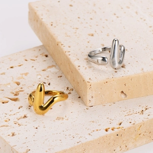 Minimalist V-shaped stainless steel open ring in gold and silver fluid wave design