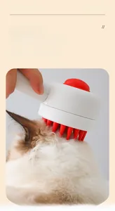 Detail of ergonomic pet bath brush with silicone bristles and integrated soap dispenser button