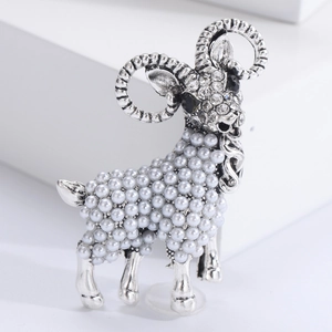 Elegant sheep brooch with silver alloy pearls and sparkling rhinestones on white display