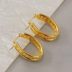 Elegant gold oval twisted hoop earrings with a textured woven design for women