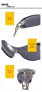 Detail view of silver snake-shaped temples and grey rimless lenses on Y2K sunglasses