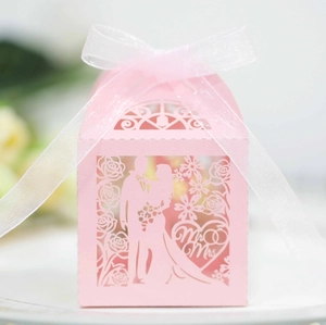 Pink hollow laser-cut wedding candy box with Mr & Mrs silhouette and organza ribbon