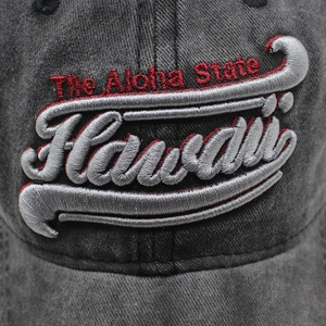 Detailed close-up of 3D Hawaii embroidery on washed cotton charcoal baseball cap
