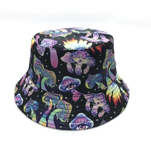 Close-up of psychedelic mushroom and eye print on a black cotton bucket hat fabric
