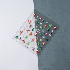 Detail of 3D embossed Christmas nail art stickers with Santa Claus and snowflake motifs