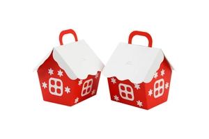 Detail of red and white house-shaped Christmas candy boxes with snowflake patterns