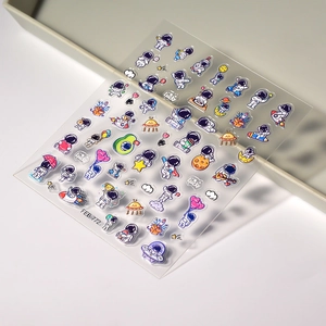 3D embossed astronaut nail stickers featuring cartoon space planets and rocket designs