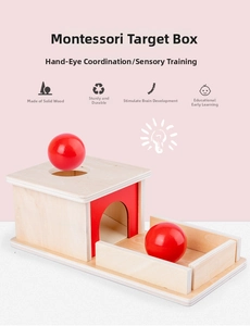 Detail of Montessori object permanence box with red wooden ball for sensory training
