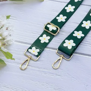 Grüner Canvas-Schultergurt mit weißen Blumenmustern und goldenen Metallschnallen