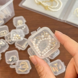 Transparent mini square plastic storage box for jewelry and rings, hand-held perspective
