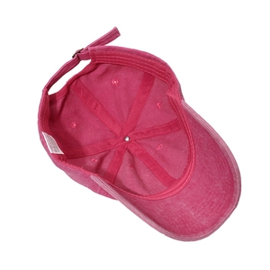 Detail view of cotton baseball cap interior featuring reinforced seams and wash label