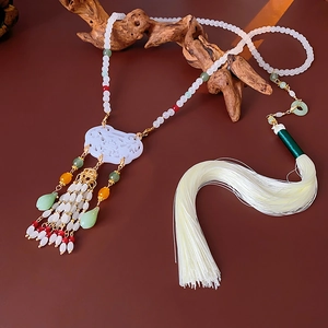 Detailed view of Chinese style floral glass bead necklace with Ruyi lock and long silk tassel