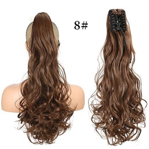 Detail of light brown wavy claw clip ponytail extension in shade 8 with macro view