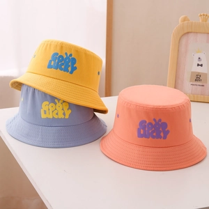 Close-up of three colorful cotton fisherman hats with Good Lucky embroidery for kids