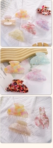Detail of colorful acetate hair claws with marble texture and strong metal spring