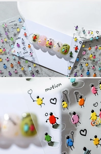 Macro detail of transparent 3D cartoon nail art stickers with colorful characters and text