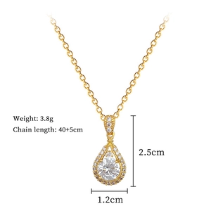 Detail view of gold teardrop pendant with dimensions 2.5cm and chain length 40+5cm