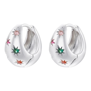 Detailed macro view of silver teardrop hoop earrings with colorful starburst gems