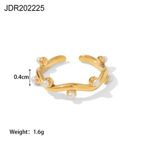 Detail showing wavy gold-plated ring with white pearl inlays, 0.4cm height and 1.6g weight