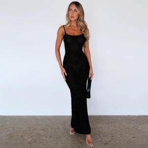 Close-up of black bodycon maxi dress featuring sparkling rhinestones and lace-up back detail