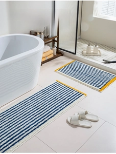 Modern blue and white striped absorbent plush bath mat set for bathroom and bathtub