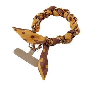 Short silk scarf phone strap with golden chain and yellow polka dots on white background