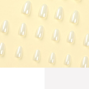 Glossy white laser glitter press-on nail tips with medium-length oval shape on yellow background