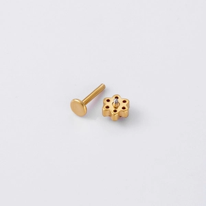Golden flower labret stud made of stainless steel with colored cubic zirconia stones